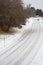 A treacherous looking road covered with snow