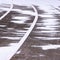 Treadmill, paved, with markings for runner athletes. In winter in snowy weathe
