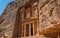 The treasury building carved into the rock face at Petra in Jor