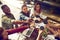 Treating the staff to a well deserved lunch. High angle shot of a group of creative workers toasting with cups of coffee