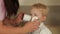 Treatment of baby`s nose using a magnetic laser.