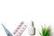 Treatment of cold and flu - various medicines, a thermometer, spray for a stuffy nose and tablets in blister on white background