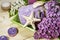 Treatment for relaxation and wellness with lilac flowers