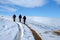 Trecking on snowy path on a sunny winter day