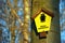 On a tree attached yellow sign with the lettering `Areas Natural Monument` in German language