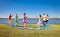 Tree couple , man and woman practice Yoga asana on lakeside.