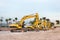 Tree excavators at construction site.