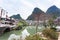 Tree with lanterns and bridge in Yangshuo town