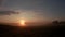 A tree is silhouetted against a sunrise near the Village of Esholt, Malham , Yorkshire Dales