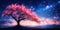 A tree stands prominently in a vast field under a sky filled with stars
