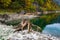 Tree stumps after deforestation near Gosauseen or Vorderer Gosausee lake, Upper Austria. Autumn Alps mountain lake with clear