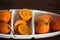 Tree tomato in white ceramic bowl on wooden background