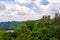 Tree tops at the Kilimanjaro National park forest in Tanzania under a cloudy sky