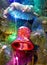 Tree toy red bell and a multi-colored luminous garland