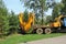 Tree transplanter heavy machine. machine for transplanting large trees. Planting large spruce