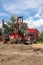 Tree transplanter heavy machine. machine for transplanting large trees. Planting large spruce trees in the park. Landscaping,