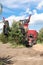 Tree transplanter heavy machine. machine for transplanting large trees. Planting large spruce trees in the park. Landscaping,