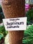 Tree trunk jasmine subhumile oleaseae with a sign
