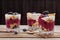 Tree yogurt desserts with fresh berries and muesli.