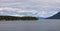 Treed Island with Homes and docks, surrounded by other islands