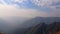 Treeless mountain range covered at morning from flat angle clip showing the beautiful natural landscape of hill range timelapse