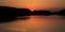 Treeline and Tawny sunset reflected in Swithland Water, Swithland Leicester