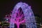 Trees and archways decorated with glowing purple neons