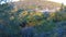 Trees and bushes on spacious hills dried by hot sun, aerial view of landscape