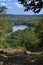 Trees framing Hart Ponds below ridge of Ragged Mountain, Connecticut.