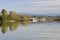 Trees on an island reflecting on river water