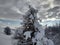 Trees and mountains loaded with snow village of Parva, Romania, Transylvania. Winter landscape