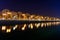 Trees and public lamps over Dambovita River at night. Horizonal