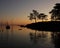 Trees reflecting in Lake Vanern on a calm summer morning