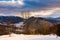 trees on a snowy slope above the valley