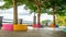 Trees surrounded with colorful concrete in the park in the riverbank,