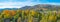 Trees with yellow autumn leaves in a spanish hilly landscape in sunlight