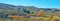 Trees with yellow autumn leaves in a spanish hilly landscape in sunlight