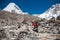 Trekker approaching PumoRi mountain in Khumbu valley on a way to