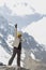 Trekker celebrating the conquest in the top of Salkantay mountain