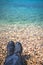 Trekker feet on the stony beach