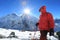 Trekker and flare over nuptse summit beside of everest