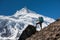 Trekker in front of Manaslu glacier on Manaslu circuit trek in N