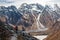 Trekker goes down fron Larke La pass on Manaslu circuit trek in