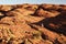 Trekker hiking among Beehive domes