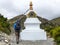 Trekker passing Stupa