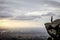 Trekker standing on the mountain with Beautiful Sunrise and sea of mist in the morning on Khao Luang mountain in Ramkhamhaeng Nati