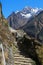 Trekker and thamserku peak from everest trek