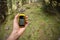 A trekker using a gps inside the forest