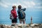 trekkers with backpack watching panoramic mountain landscape