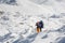 Trekkers crossing Gokyo glacier in Khumbu valley on a way to Eve